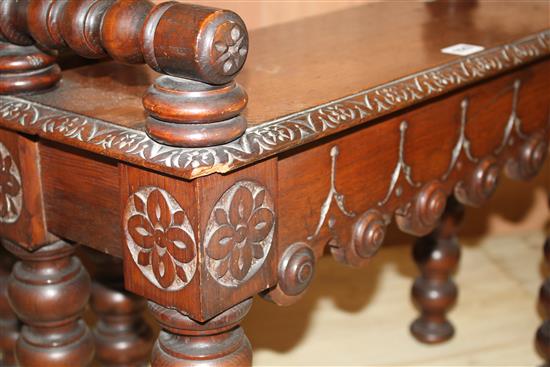 A pair of small late Victorian carved oak hall benches, W.65cm D.25cm H.43cm